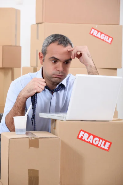 Stressed warehouse worker — Stock Photo, Image