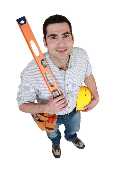 Craftsman holding a level — Stock Photo, Image