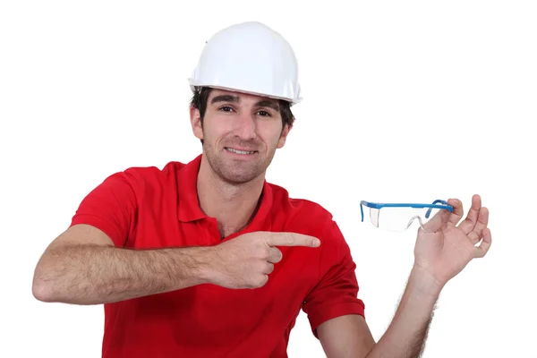 Man pointing to his goggles — Stock Photo, Image