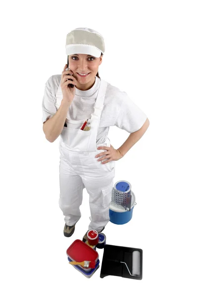 Painter posing with her supplies — Stockfoto
