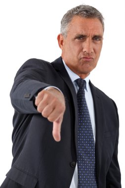 Disapproving businessman giving the thumb's down clipart