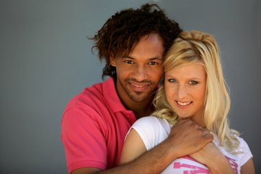 Mixed race couple stood together clipart