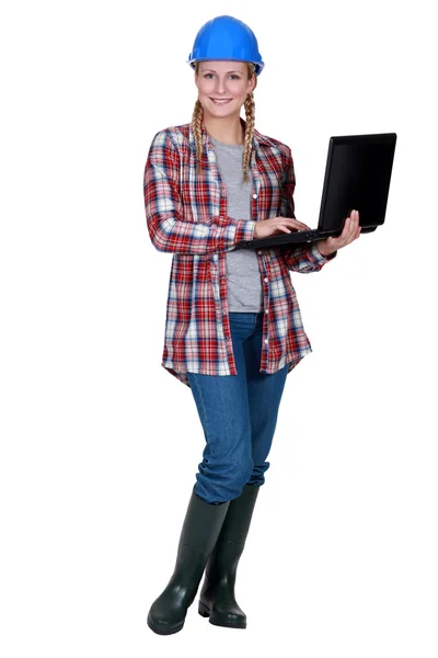 A female foreman with a laptop. — Stock Photo, Image