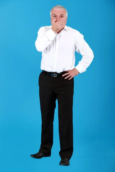 Cutout businessman with his hand over his mouth — Stock Photo, Image