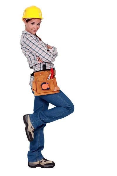 Tradeswoman leaning against an invisible wall — Stock Photo, Image