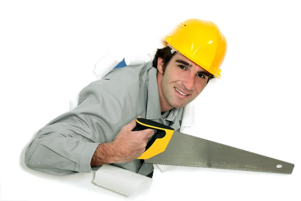 Tradesman holding a crosscut saw — Stock Photo, Image
