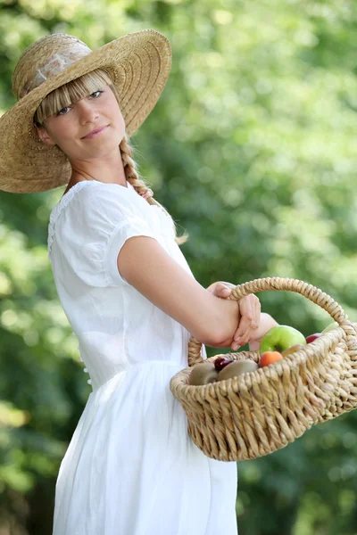 Fair-haired belle with basket Stock Image