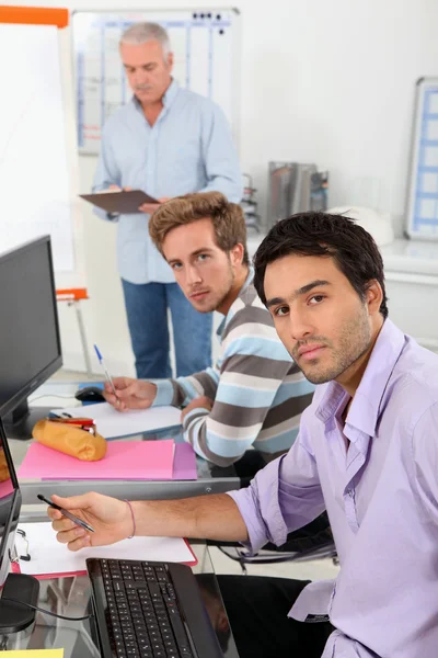 Business students using computers Stock Image