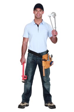 Plumber holding pipe bending tool clipart