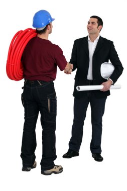 Tradesman and engineer meeting for the first time clipart