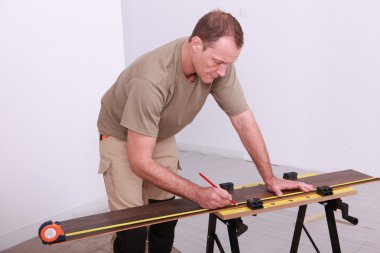 Man working on a workbench clipart