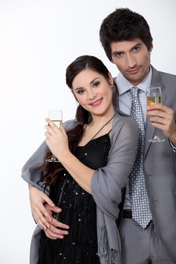 Glamorous couple drinking champagne clipart