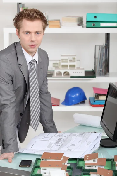 Businessman looking at an architectural draw — Stock Photo, Image