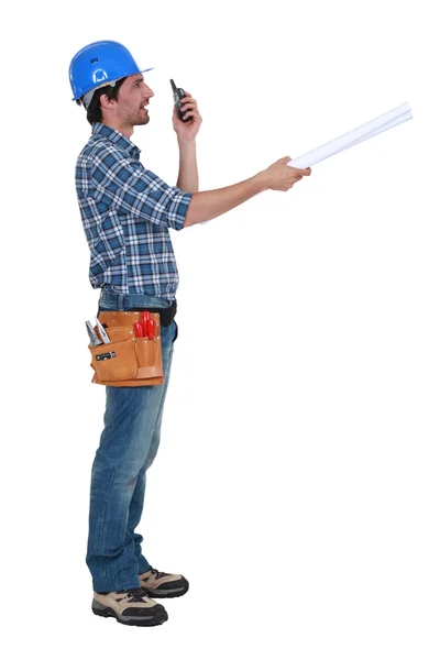 Tradesman trying to communicate with his colleague from a distance — Stock Photo, Image