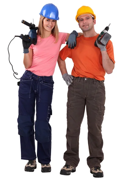 Couple stood with power drills — Stock Photo, Image