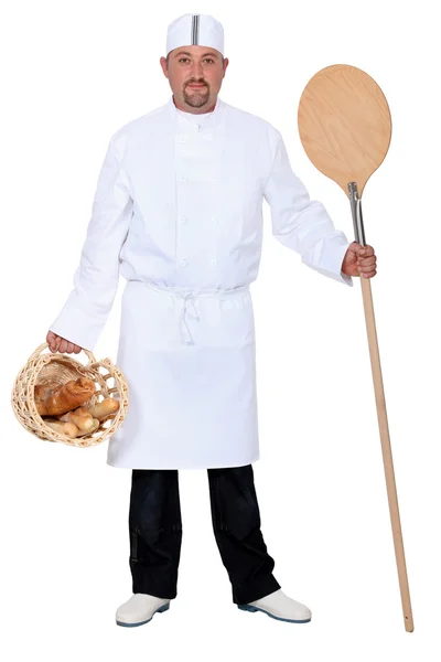 Baker with basket and paddle — Stock Photo, Image