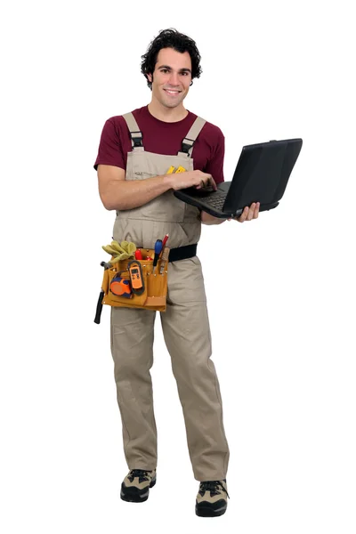 Carpenter with laptop computer — Stock Photo, Image
