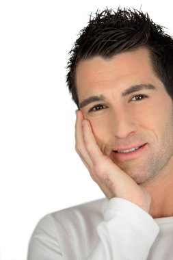 Man with gelled hair and his chin resting in his hand clipart