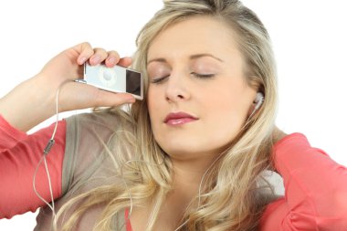 Blonde with eyes shut listening to music clipart