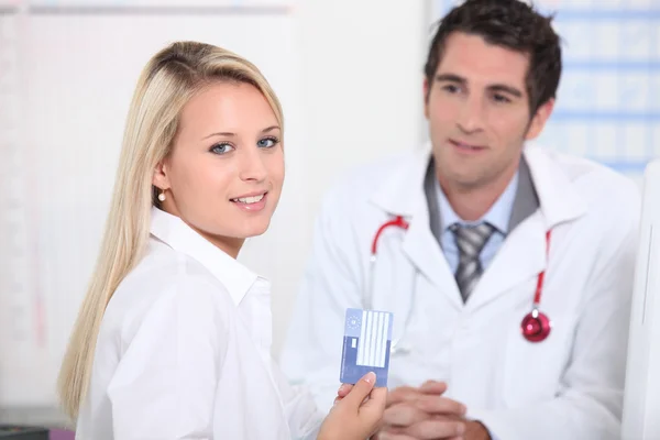 Young female patient registering her details — Stock Photo, Image