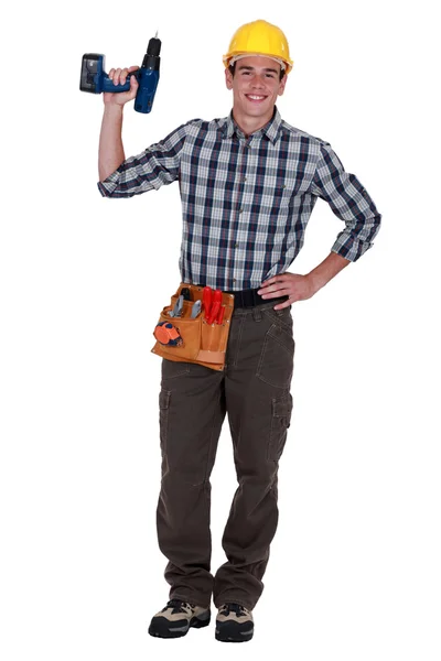 Tradesman holding a screwdriver — Stock Photo, Image