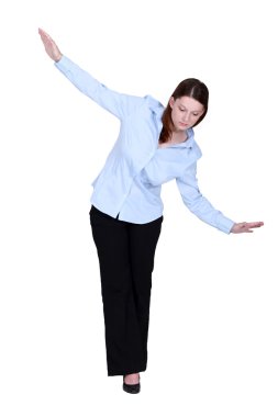 Woman walking an imaginary tightrope clipart