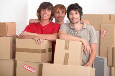 Young men on moving day clipart