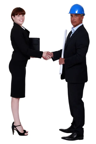 Businesswoman and real estate businessman shaking hands — Stock Photo, Image