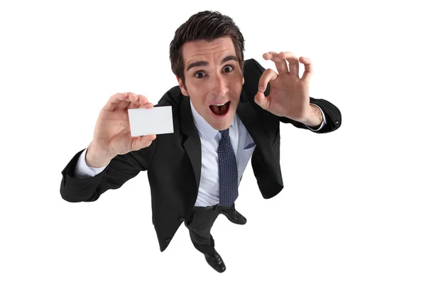 Excited man holding business card — Stock Photo, Image