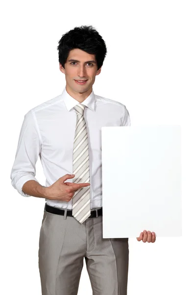 Businessman with blank poster — Stock Photo, Image