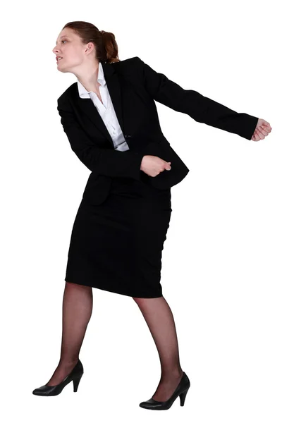 Businesswoman pulling an invisible chain — Stock Photo, Image