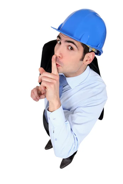Inženýr drží prst na rty — Stock fotografie