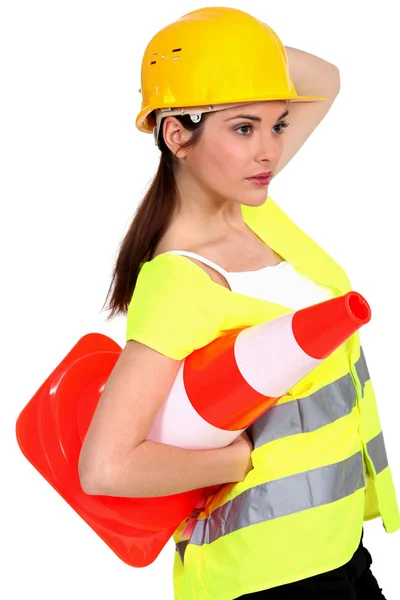 A traffic controller carrying a pylon — Stock Photo, Image