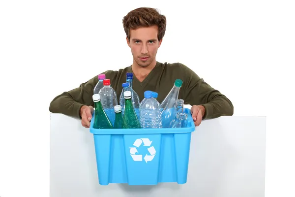 Man holding box full of empty bottles — Stock Photo, Image