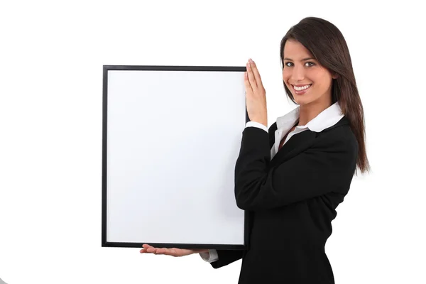 Attractive businesswoman with picture frame — Stock Photo, Image