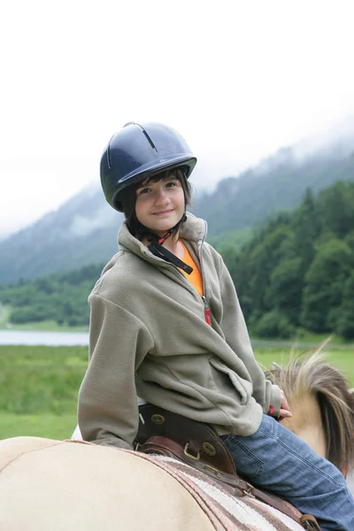 Little boy riding horse — Stock Photo, Image