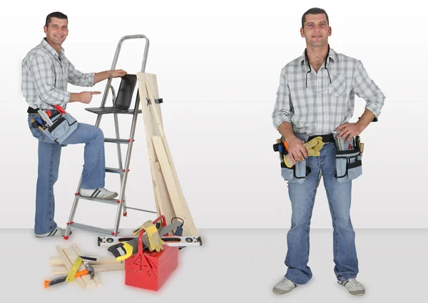 Happy woodworker with ladder, laptop computer and tools — Stock Photo, Image