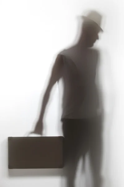 Μια σκιά ενός ανθρώπου που κρατώντας ένα χαρτοφύλακα. — Φωτογραφία Αρχείου