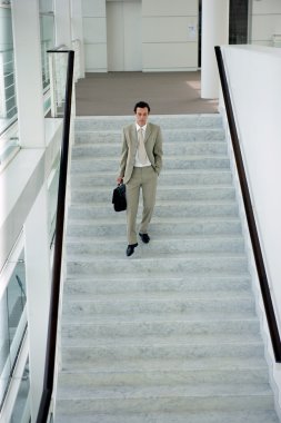 Man walking down stairs clipart