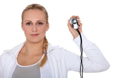 Blond girl in sportswear showing stopwatch clipart