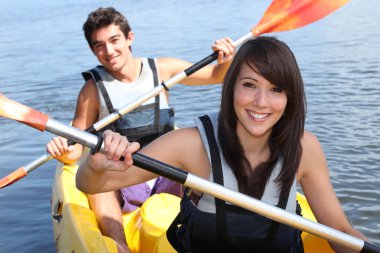 Couple in kayak clipart