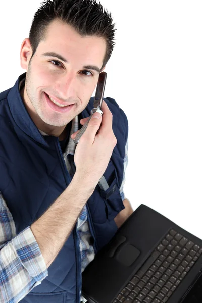 Handsome man listening to a voice message — Stock Photo, Image