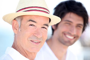 Father and son enjoying each other's company on a sunny summer's clipart