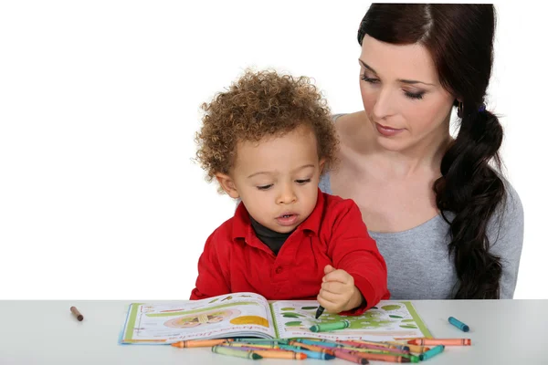 stock image Mother and son coloring-in together