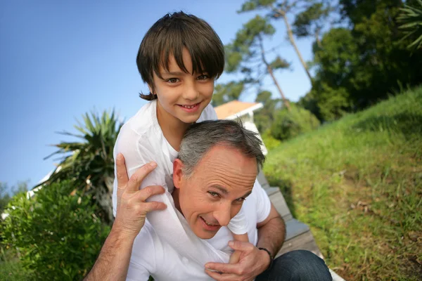 stock image Father and son horsing around