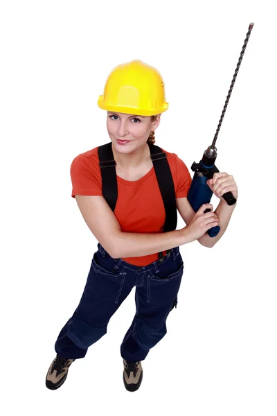 Tradeswoman segurando uma ferramenta de poder — Fotografia de Stock