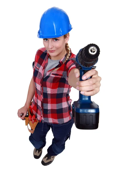 A female handyman with a drill. — Stok fotoğraf