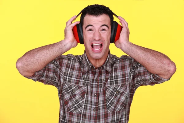 Builder wearing hearing protection — Stock Photo, Image