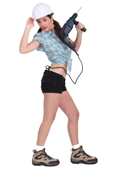 Donna sexy con un cacciavite elettrico — Foto Stock