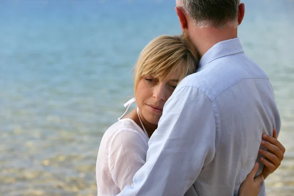 Blonde woman hugging her husband — Stock Photo, Image